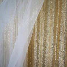 gold sequin backdrop with white sheer fabric and curtain drape for wedding ceremony decoration