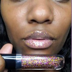 Purple and gold sparkle lip gloss mixed to perfection in a luxury applicator tube to get a good ratio of both shades | goes on clear with just the right amount of sparkle . Can be worn alone for sparkly lips or paired with your favorite lippie to give it a sparkle , glossy finish. *We recommend choosing squeeze tubes to get the full amount of glitter payoff. With wand tubes the applicator only pulls a little amount of glitter out the tube no matter how much glitter is put so you'll have to apply it in layers.* Hand-Crafted Vegan Cruelty-Free Moistourizing Oil infused (Castor, vitamin E,Sweet almond oils) Glossy Sparkly Lips, Sparkle Lip Gloss, Holographic Lips, Sparkle Lips, Small Lips, Purple Sparkle, Gold Sparkle, Makeup Tools Brushes, Sweet Almond Oil