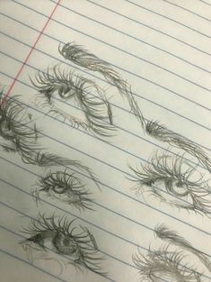 several drawings of eyes on lined paper