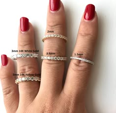 a woman's hand with four different rings on it and the width of each ring