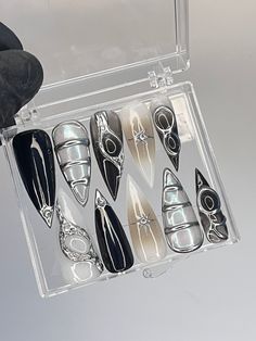 a clear case holds six pairs of shoes and one pair of black gloves in it