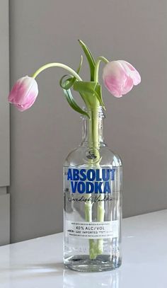 there is a bottle with some flowers in it