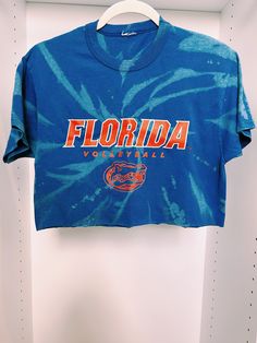 University of Florida Volleyball tie dye crop top. It best fits a women's size medium but it can fit a size small for an oversized look. It is super cute on and in great condition. Trendy Acid Wash Crop Top, Acid Wash Cropped Crop Top, Tie Dye Short Sleeve Crop Top For Summer, Tie-dye Cropped Cotton Tops, Tie Dye Cropped Top, Acid Wash Cropped Crew Neck T-shirt For Summer, Cropped Tie Dye Cotton Tops, Spring Tie Dye Cropped Crop Top, Spring Tie-dye Short Sleeve Crop Top