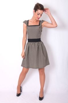 Plaid dress, waist cut with shirred skirt, short sleeves and squared neckline. Invisible side zipper clousure. Dress length: 91cm. *Belt not includedSizes guide:S: Bust 84-88 - Waist 66-70cm - Hip 90-94cmM: Bust 88-92 - Waist 70-74cm - Hip 94-98cmL: Bust 92-96 - Waist 74-78cm - Hip 98-102If you have any doubt when choosing your size, just email us at floren@dresses2kill.com. Fitted Mini Dress With Cap Sleeves And Ruffles, Chic Fitted Smocked Dress With Square Neck, Fitted Cap Sleeve Dress With Ruffles, Fitted Smocked Dress With Short Sleeves, Fitted Smocked Dress With Gathered Neckline And Short Sleeves, Fitted Mini Dress With Smocked Bodice And Short Sleeves, Retro Fitted Square Neck Dress, Fit And Flare Square Neck Ruched Dresses, Casual Fitted Smocked Dress With Short Sleeves