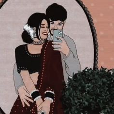 a man and woman taking a selfie in front of a mirror with their arms around each other