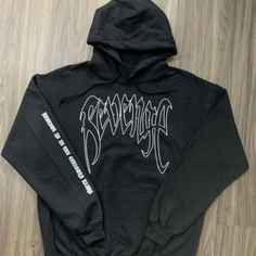 This Is The Xxxtentacion Revenge Hoodie With "Revenge Is In The Creators Hands" On The Sleeve On A Black Hoodie With A White Design. White Grunge Hoodie For Streetwear, Edgy White Sweatshirt For Streetwear, Band Merch Hoodie For Winter Streetwear, Winter Band Merch Hoodie For Streetwear, Winter Band Merch Sweatshirt For Streetwear, Winter Streetwear Band Merch Hoodie, Black Long Sleeve Sweatshirt With Band Logo, Black Band Logo Sweatshirt For Streetwear, Black Sweatshirt With Band Logo For Streetwear