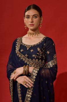 COLOR : Navy Blue FABRIC : Saree - Heavy Georgette, Blouse - Banglori Silk WORK : Zari, Dori Work, Sequins, Tassels & Lace BorderOCCASION : Wedding, Engagement, Party Wear, Festival, Sangeet NOTE : The outfit includes blouse and saree only. Petticoat is not included. READY-TO-WEAR : No STITCHING : Available as semi-stitched fabric, can be stitched using standard size option (+$20). Note: There might be a slight color variation due to lighting and flash used during photoshoot. The bright shade se Blue Wedding Saree, Western Saree, Saree Heavy, Dori Work, Anarkali Gown, Georgette Blouse, Navy Blue Wedding, Blue Saree, Navy Blue Fabric