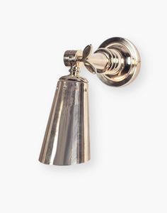 a silver bell on a white background