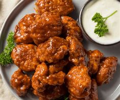 buffalo wings with ranch dressing on a plate