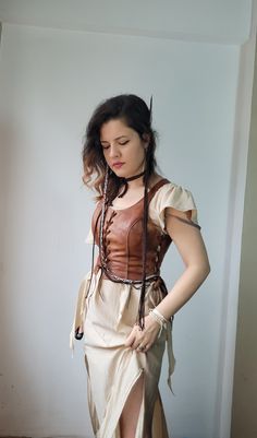 Unique quality real calf leather is used.  With its historical texture, it is a vest bodice that you will enjoy using at costume parties, renaissance fairs, concerts or in your daily life. Ajdustable size with 3 elevator with eyelets.  Ready to shipping  Worldwide free express shipping is used Any size avaliable . Please message me your bust, waist and height measurements Witcher Outfits Female, Steampunk Corset Belt For Fantasy Events, Bohemian Medieval Dress For Festival, Medieval Style Brown Overbust Corset, Medieval Brown Overbust Corset, Medieval Style Corset For Larp, Fantasy Style Corset Belt For Larp, Bohemian Medieval Dress For Cosplay, Medieval Style Corset Belt For Medieval Festivals