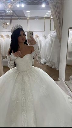 a woman taking a selfie in her wedding dress