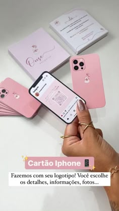 someone is holding their phone in front of some pink cases