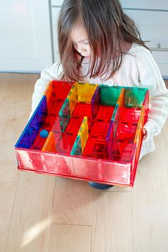 Little girl playing with a maze made of magnetic tiles and trying to get a ball through the maze Magna Tiles Ideas, Magnatiles Ideas, Magnet Activities, Sports Activities For Kids, Magnetic Building Tiles, Blocks Preschool, Magnet Ideas, Magna Tiles, Tiles Ideas