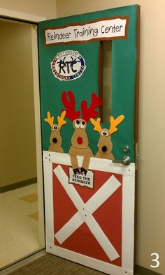 a door decorated to look like a barnyard with reindeers on it and the words reindeer training center