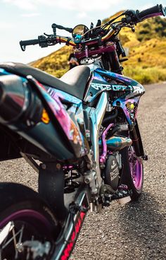 a motorcycle parked on the side of a road