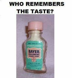 a bottle of bayer children's cough syrup sitting on a white tablecloth