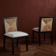 two chairs sitting next to each other on top of a wooden floor