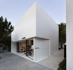 a white building with the word chanel written on it's front door and windows