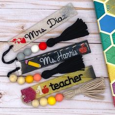 the teacher's name bracelets are lined up next to each other on a table