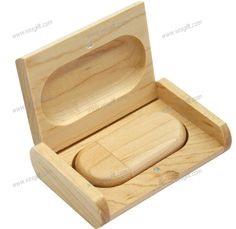 an empty wooden box with a lid on the inside, and a hole in the middle