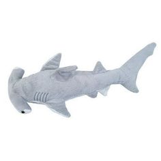 a stuffed shark is shown on a white background