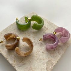 3 Gorgeous Pairs Of Unique Luxury Boutique Earrings, That You Will Be Sure To Receive Many Compliments On! Acrylic Jade Tone Acrylic Lavender Tone Acrylic Amber Tone Buy 2, Get 1 Free On All Jewelry Items From My Closet! (Free Item Will Be Of Equal Or Lesser Value) Check Out My Other Unique Boutique Jewelry! Boutique Quality Alloy, Hypoallergenic, Lead Compliant & Nickel Free (Great For Sensitive Ears) Brand New With Tags Be Sure To Check Out My Other Closet Bundle Sales All Items In My Closet C Trendy Small Hoop Purple Jewelry, Trendy Purple Small Hoop Jewelry, Purple Round Hoop Earrings For Gift, Purple Round Hoop Earrings As Gift, Trendy Purple Hoop Jewelry, Purple Hoop Earrings As Gift, Trendy Purple Jewelry For Everyday, Trendy Purple Everyday Jewelry, Trendy Everyday Purple Jewelry