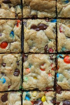 chocolate chip cookies with m & m candies are arranged on top of each other