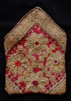 This is a beautiful metallic embroidered Uzbek pouch.  The inner lining is in a cotton block printed material.  The workmanship is exquisite.    -Metallic embroidery-Cotton block printed lining Traditional Gold Embroidered Fabric, Traditional Embroidered Pouch For Festivals, Traditional Pouch With Intricate Embroidery For Festivals, Traditional Festival Pouch With Intricate Embroidery, Traditional Gold Embroidered Fabric For Celebration, Handwork Embroidered Fabric For Ceremonial Festivals, Ceremonial Embroidered Fabric With Handwork For Festivals, Traditional Red Pouch, Folk Style Embroidered Fabric For Ceremonial Festivals