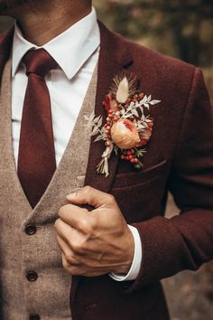 a man in a suit with a boutonniere on his lapel