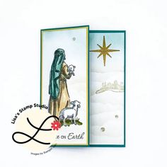 a christmas card with an image of a woman holding a lamb and the words let's stamp studio on it