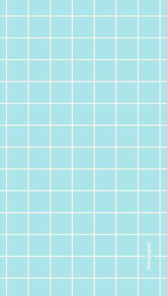 a blue tiled wall with white squares on it