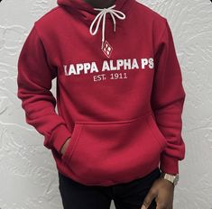 This Kappa Alpha Psi red floating K Premium hoodie is a must-have for any fraternity member looking for a stylish and comfortable addition to their wardrobe. The hoodie features the iconic Kappa Alpha Psi logo on the chest, making it a great way to show your pride in your organization. The hoodie is made of high-quality materials and is designed to provide both comfort and warmth. It is perfect for wearing to events, meetings, or just around campus. With its classic design and comfortable fit, t Casual Red Hoodie With Drawstring Hood, Red Fleece Hoodie With Double-lined Hood, Casual Red Fleece Hoodie, Casual Red Hoodie With Double-lined Hood, Red Casual Hoodie With Double-lined Hood, Casual Red Hoodie With Adjustable Hood, Red Casual Hoodie With Adjustable Hood, Casual University Red Crew Neck Hoodie, Casual University Red Fleece Hoodie