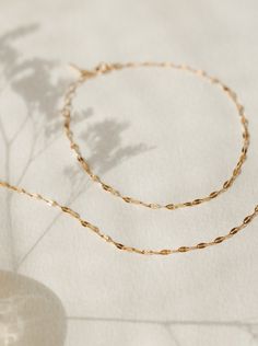 Light up your bracelet stack with a glowing string of solid gold: a high-shine staple you can put on…and leave on forever. Available in an adjustable 6.25-7.25" length or a custom length to fit any wrist! 10k solid gold is:- more durable and scratch-resistant than 14k- made for a lifetime of 24/7 wear- nearly indistinguishable from 14k in color and shine- able to be polished and refinished indefinitely- waterproof and sweat-proof—just no chemicals, please! We even wrote a journal about why 10k i Adjustable 14k Gold-filled Paperclip Chain Bracelet, Dainty Adjustable 14k Gold Paperclip Bracelet, Adjustable Gold Figaro Chain Bracelet, Adjustable Yellow Gold Bracelet With Figaro Chain, Adjustable 14k Gold Jewelry With Paperclip Chain, Adjustable Figaro Chain Gold Bracelet, Adjustable 14k Gold Delicate Chain Bracelet, Hypoallergenic Adjustable Link Jewelry, Adjustable Gold Bracelet With Figaro Chain