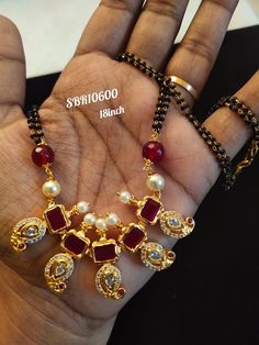 Gorgeous one gram gold black bead chains studded with pink color stones. Black bead chain with mango hangings.  21 October 2019 Black Bead Chains, One Gram Gold Jewellery, Mangal Sutra, Silk Sarees With Price, Gold Jewelry Outfits, Diamond Mangalsutra, Beads Ideas, Bangles Design