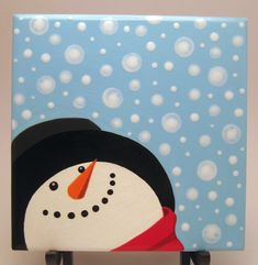 a snowman painted on a blue background with bubbles