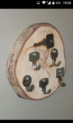 a piece of wood that has some keys in it and is hanging on the wall