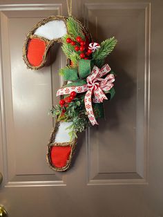 a door hanger decorated with christmas decorations