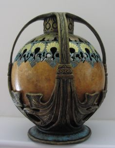 an ornate vase is sitting on a table