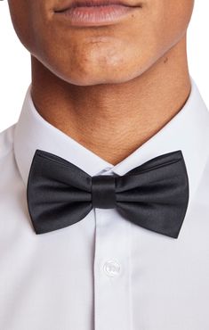 An updated version of the classic bowtie, the Bradley Bowtie in Satin Black makes an excellent addition to any formal outfit. The bowtie is pre-tied and adjustable, making it the perfect combination of convenience and elegance. PRODUCT DETAILS: style 6595B pre-tied bow tie adjustable band t-hook-to-fabric closure 100% polyester imported Pre-tied Satin Bow For Black Tie Events, Classic Adjustable Bow For Business, Adjustable Classic Bow For Business, Classic Bow Tie For Black-tie Events, Classic Adjustable Bow Tie For Black-tie Events, Classic Pre-tied Bow Tie, Classic Pre-tied Decorative Bow, Classic Adjustable Satin Bow Tie, Classic Adjustable Bow With Bow Tie Back