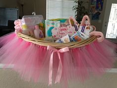 a basket filled with baby items sitting on top of a table