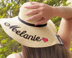 ----Send us a convo if you want more sun hats in order to offer you a lower price and calculate the shipping cost according destination and weight---- Name and heart on sun hat | Personalized | Machine embroidered | Wide-Brimmed Sun hat | Made of  paper straw   100% Paper Straw Sweatband: 100% Polyester Domed crown Wide brimmed design Embroidered Summer Hat With Short Brim, Summer Brimmed Hats With Embroidery, Summer Embroidered Short Brim Hat, Embroidered Wide Brim Summer Hat, Summer Embroidered Wide Brim Hat, Summer Wide Brim Embroidered Hats, Beach Sun Hat With Embroidered Short Brim, Embroidered Sun Hat For Summer, Embroidered Straw Hat For Beach With Short Brim