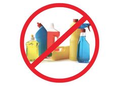 there is a red sign that says no plastic bottles in front of the bottle are yellow and blue