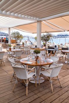 an outdoor dining area with tables and chairs