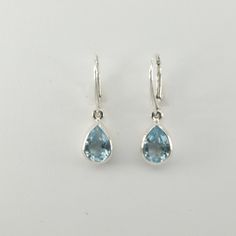 These is a pair of beautiful Earrings with Blue Topaz. The earrings are made out of solid 925 Silver and there is no nickel or other substances causing most allergies. This makes the earrings hypo allergenic. Size of one Earring in total 3.1 x 0.9 cm or  1.22 x 0.35 inch You will receive the item in a gift box - perfect to surprise someone or yourself. Usually we ship on the same day we receive the payment for the order. We want you to be happy with your purchase. If you do not like what you bou Etsy Earrings Dangle, Beautiful Earrings, Blue Topaz, Jewelry Earrings Dangle, Topaz, Pear, 925 Silver, Dangle Drop Earrings, Dangle Earrings