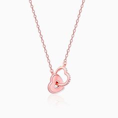 The Inspiration: The Rose Gold Interlocked Hearts Necklace is inspired by the idea of how two hearts connect for life. The Design: The Rose Gold Necklace has a solid and outlined heart interlocked with each other. 
 
 925 Silver with gold Plating 
 AAA+ Quality Zircons 
 Pendant Dimensions: 2.9 cm x 2.1 cm 
 The length of the necklace is 43 cm with a 5 cm adjustable portion 
 Hypoallergenic - Perfect for sensitive skin 
 
 Comes with the Jewellery kit and authenticity certificate 
 Net Qty- 1 piece 
 
 Styling Tip: Style this necklace with a casual red t-shirt Rose Gold Double Heart Necklace For Anniversary, Rose Gold Double Heart Necklace For Valentine's Day, Valentine's Day Rose Gold Double Heart Necklace, Rose Gold Double Heart Charm Necklace, Rose Gold Double Heart Necklace With Charm, Pink Heart Pendant Necklace For Anniversary, Rose Gold Double Heart Necklace, Authenticity Certificate, Hearts Necklace