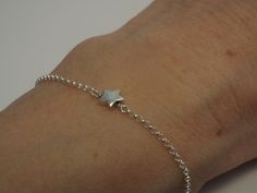 *Make a wish* Tiny Star Bracelet This sweet little bracelet is Solid Sterling Silver. The chubby little star is approx 6mm. The chain is a very sturdy elongated rolo link. Clasps closed with a classic spring style clasp. All items arrive in a small jewelry box tied with ribbon. Dainty Star Charm Bracelet Gift, Star Silver, Silver Chain Style, Tiny Star, Small Jewelry Box, Star Bracelet, Bracelet Sterling Silver, Dainty Bracelets, Small Jewelry