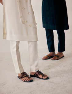 Editor's Note Featuring Ivory Applique Flower Motif Scattered Kurta. Paired With Tone On Tone Tapered Trousers. Fabric: Crepe Color: White Component: Kurta, Trousers Care: Dry Clean Only About the Designer After establishing himself as the leading couturier in the industry of menswear, Jatin Malik went on to explore luxury footwear. You can order online these amazingly designed handmade shoes that are being offered in classy Caligae and Peshawari patterns! We recognize that more men are opting f Applique Kurta, Jatin Malik, Applique Flower, Kurta Set For Men, Luxury Footwear, Tapered Trousers, Tone On Tone, Flower Motif, Floral Applique