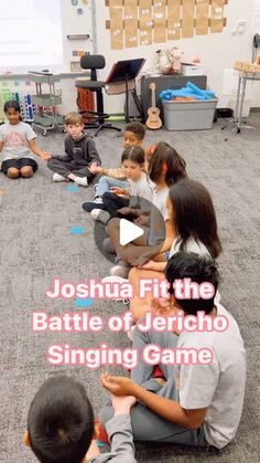 a group of children sitting on the floor in front of a screen with text that reads, joshua fit the battle of jerioo singing game