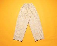 Vintage 90's patterned trousers in pastel. Features an elastic waist, button-topped zip fly and two pockets. Made of 100% cotton. Vintage condition level: 8/10.* Shows overall wear but nothing in particular. SIZE. Marked size 148, approx. 13 - 14 years. To be sure it would fit please check the measurements below.  FLAT Measurements: Side to side ( stretches to larger): 9" / 23 cm Length: 35 1/2" / 90 cm Inseam: 24 1/2" / 62 cm SKU - M95 *We assess the condition of our vintage items on a scale fr Side Stretches, Teen Pants, Motif Vintage, Pants Vintage, Cotton Trousers, New Vintage, Tapered Legs, Pastel Colors, Abstract Pattern