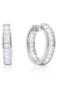 Hand-set baguette stones create a dazzling effect on these platinum-plated hoop earrings. 1/4" diameter Hypoallergenic Total stone weight: 4.0ct. Sterling silver/platinum plate/cubic zirconia Imported Silver Emerald Cut Diamond Earrings With Baguettes, Small Hoop Baguette Diamond Earrings For Anniversary, Small Hoop Earrings With Baguette Diamonds For Anniversary, Modern Baguette Cut Hoop Earrings For Anniversary, Modern Baguette Diamond Hoop Earrings For Anniversary, Classic Hoop Earrings With Baguette Diamonds For Anniversary, Silver Hoop Earrings With Baguette Diamonds For Anniversary, White Gold Huggie Earrings With Baguette Cut For Anniversary, Baguette Diamond Hoop Earrings For Anniversary